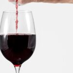 Why do we get headaches from drinking red wine?