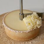 The physics of frilly Swiss cheese “flowers”