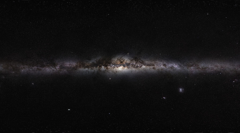 Simulations find ghostly whirls of dark matter trailing galaxy arms